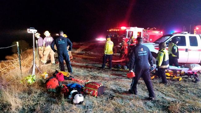 In this Wednesday, Sept. 18, 2019 photo provided by the California Department of Forestry and Fire Protection (Cal Fire) emergency personnel work as the scene of a tour bus crash, on Highway 46 near Shandon in California's Central Coast region. Authorities said the passenger bus crashed while carrying the road crew for country and gospel singer Josh Turner, leaving one dead and seven injured. Turner and his band were not on the bus.(Capt. Adan Orozco/Cal Fire via AP)