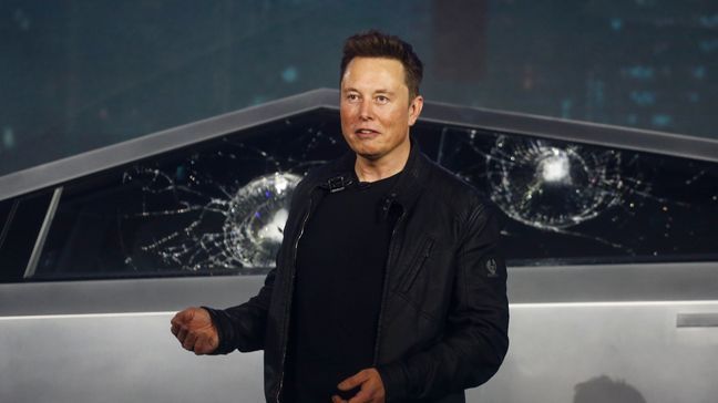 Tesla CEO Elon Musk introduces the Cybertruck at Tesla's design studio Thursday, Nov. 21, 2019, in Hawthorne, Calif. Musk is taking on the workhorse heavy pickup truck market with his latest electric vehicle. (AP Photo/Ringo H.W. Chiu)