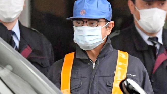 A masked man, center, believed to be former Nissan Chairman Carlos Ghosn, center with blue cap, leaves Tokyo’s Detention Center in Tokyo, Wednesday, March 6, 2019. Ghosn was released Wednesday after putting up 1 billion yen ($8.9 million) in bail. (Yu Nakajima/Kyodo News via AP)