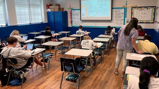 FILE - Math teacher Cheyenne Crider helps a seventh-grade student with a math problem at Piedmont Middle School in Piedmont, Ala., on Thursday, Aug. 31, 2023. (Trisha Powell Crain/AL.com via AP)