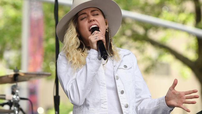 FILE - In this May 26, 2017 file photo, singer Miley Cyrus performs on NBC's "Today" show in New York. Cyrus will join Ariana Grande at a charity concert called "One Love Manchester" in Manchester, England, Sunday, June 3, 2017, two weeks after a bomber killed 22 people at Grande's concert in Manchester.  (Photo by Evan Agostini/Invision/AP, File)