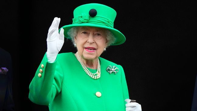 FILE - Britain's Queen Elizabeth II waves to the crowd during the Platinum Jubilee Pageant at the Buckingham Palace in London, June 5, 2022, on the last of four days of celebrations to mark the Platinum Jubilee.{&nbsp;} (AP Photo/Frank Augstein, Pool)