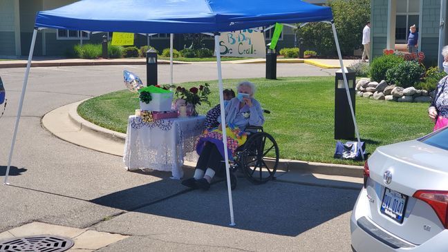 Sister Cecile celebrates her socially distanced birthday with friends and family on Aug. 11, outside the Ascension Borgess assisted living center.{&nbsp;} (WWMT/ Manny Revilla){p}{/p}