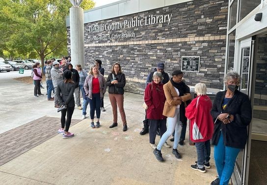 Image for story: Jimmy Carter votes for Harris amid record early turnout in Georgia