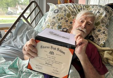 Image for story: 98-year-old Marine veteran in hospice care finally receives his high school diploma