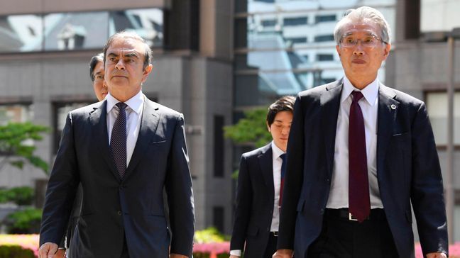 FILE - In this May 23, 2019, file photo, former Nissan chairman Carlos Ghosn, left, accompanied by his lawyer Junichiro Hironaka, arrives at Tokyo District Court for a pre-trial meeting in Tokyo. Lawyers for Ghosn, who is awaiting trial in Japan, asked the court on Thu (Ren Onuma/Kyodo News via AP, File)