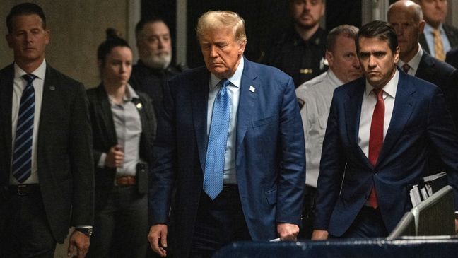 Former President Donald Trump, with his attorney Todd Blanch at his side,  arrives for his trial at Manhattan Criminal Court, Thursday, May 9, 2024, in New York. (Victor J. Blue/The Washington Post via AP, Pool)