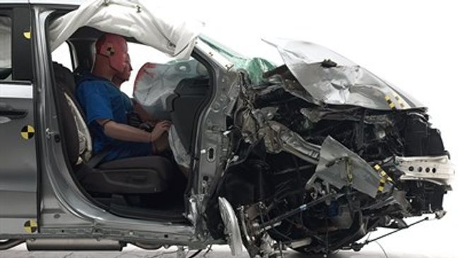 The dummy's position in the 2018 Honda Odyssey in relation to the door frame and dashboard after the crash test indicates that the passenger's survival space was maintained reasonably well.{&nbsp;}(Image courtesy of the Insurance Institute for Highway Safety)