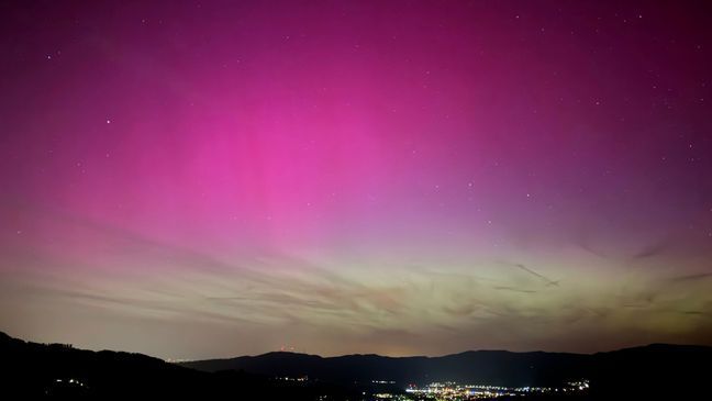 Northern lights appear over the Dreisamtal valley in the Black Forest near Freiburg, Germany, Friday evening, May 10, 2024. (Valentin Gensch/dpa via AP)