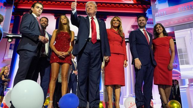 Republican presidential candidate former President Donald Trump stands on stage with former first lady Melania Trump, family members and Republican vice presidential candidate Sen. JD Vance, R-Ohio, and his wife Usha Chilukuri Vance, during the 2024 Republican National Convention at the Fiserv Forum, Thursday, July 18, 2024, in Milwaukee. (AP Photo/Carolyn Kaster)