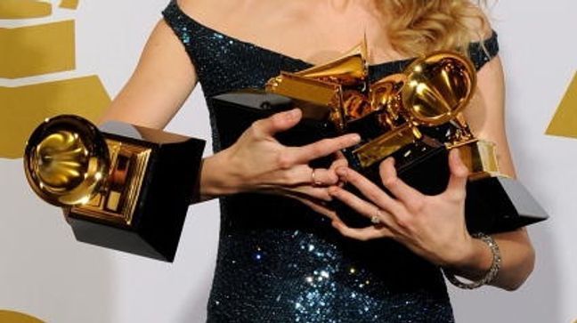 Swift drops one of her four Grammy awards at the 52nd annual Grammy Awards in Los Angeles on Jan. 31, 2010. She won Album of the Year and Best Country Album for "Fearless" and Best Female Vocal Performance and Best Country Song for "White Horse."