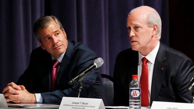 John Bozella, president and CEO of the Association of Global Automakers, left, listens as Joseph Boyle, senior director of business development and sales at LG Electronics, speaks during a Commerce Department hearing on investigation into whether auto imports threaten national security, Thursday, July 19, 2018, at the Commerce Department in Washington. The Commerce Department holds a daylong hearing on the latest trade fight the Trump administration is primed to start: It wants to impose tariffs on imported autos and auto parts, a move that President Donald Trump says would aid American workers but that could inflate car prices, make U.S. manufacturers less competitive and draw retaliation from other nations. (AP Photo/Jacquelyn Martin)