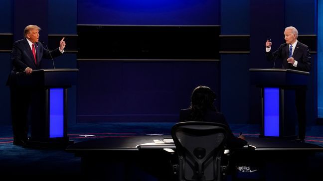 U.S. President Donald Trump, left, and Democratic presidential candidate former Vice President Joe Biden attend the second and final presidential debate Oct. 22, 2020, at Belmont University in Nashville, Tenn. (AP Photo/Patrick Semansky, File)