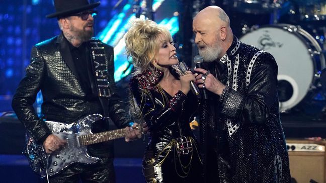 Inductees Dave Stewart of Eurythmics, from left, Dolly Parton and Rob Halford of Judas Priest perform during the Rock & Roll Hall of Fame Induction Ceremony on Saturday, Nov. 5, 2022, at the Microsoft Theater in Los Angeles. (AP Photo/Chris Pizzello)