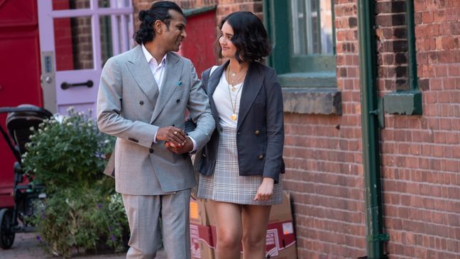 Max (Utkarsh Ambudkar) and Lucy (Geraldine Viswanathan) on their way to work at the Eva Woolf Gallery in TriStar Pictures THE BROKEN HEARTS GALLERY. (Photo: Sony)