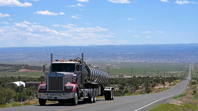 FILE - A tanker truck transports crude oil on a highway near Duchesne, Utah on July 13, 2023. (AP Photo/Rick Bowmer, File)