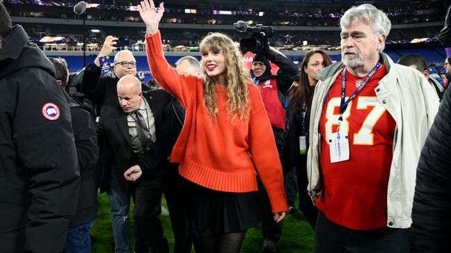 Taylor Swift waves as she walks with Ed Kelce after the AFC Championship NFL football game between the Baltimore Ravens and the Kansas City Chiefs, Sunday, Jan. 28, 2024, in Baltimore. The Chiefs won 17-10. (AP Photo/Nick Wass)