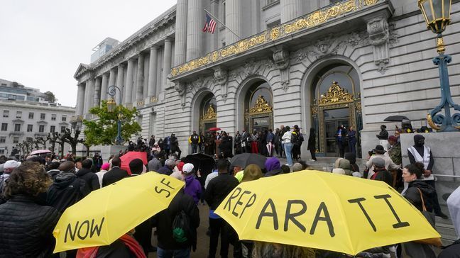 FILE - A crowd listens to speakers at a reparations rally outside of City Hall in San Francisco, on March 14, 2023. (AP Photo/Jeff Chiu, File)