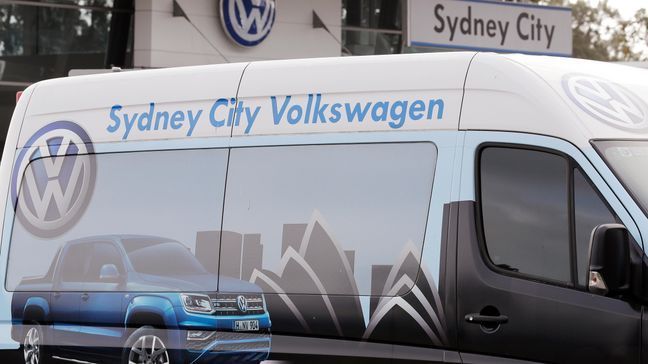 A service vehicle is parked at a Volkswagen dealership in Sydney, Monday, Sept. 16, 2019. Volkswagen has agreed to pay up to 127 million Australian dollars ($87 million) to settle an Australian class action stemming from the 2015 diesel emissions scandal, the German automaker and a lawyer said Monday. (AP Photo/Rick Rycroft)