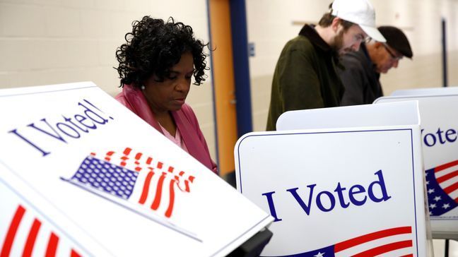 FILE - Voters fill out their ballots at a polling place, Feb. 29, 2020, in Charleston, S.C. (AP Photo/Patrick Semansky, File)