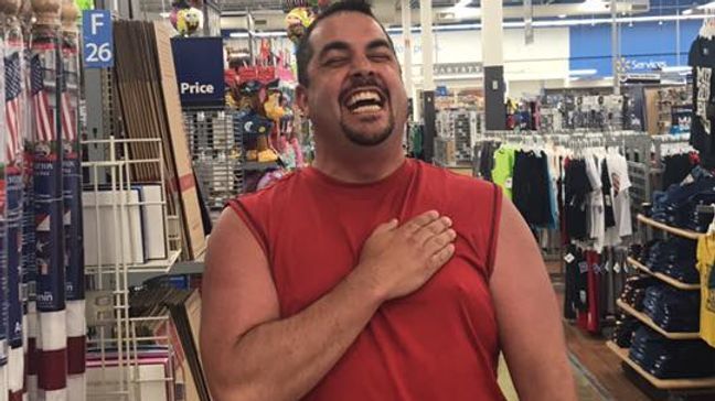 James Fruits belts out the national anthem in the flag aisle. Walmart managers quickly asked him to sing again, but on the intercom for all to hear. (James Fruits)