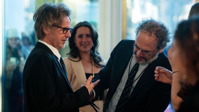 Dana Carvey, left, has his tie inspected by Robert Smigel before walking the red carpet for the 24th Annual Mark Twain Prize for American Humor at the Kennedy Center for the Performing Arts, Sunday, March 19, 2023, in Washington. (AP Photo/Kevin Wolf)