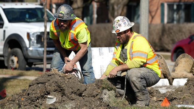 FILE - Construction workers work in Mount Prospect, Ill., Monday, Feb. 26, 2024. (AP Photo/Nam Y. Huh)