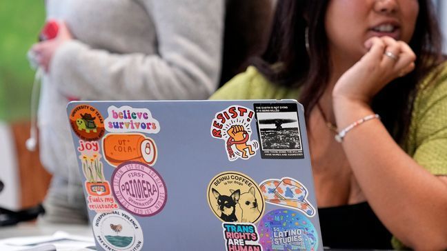 University of Texas at Austin student Amanda Garcia studies in a space that housed the school's "Multicultural Center" after the name was removed from the wall, Monday, Jan. 29, 2024, in Austin, Texas. (AP Photo/Eric Gay)