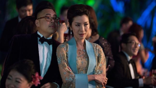 (L-R) NICO SANTOS as Oliver and MICHELLE YEOH as Eleanor in Warner Bros. Pictures' and SK Global Entertainment's and Starlight Culture's contemporary romantic comedy "CRAZY RICH ASIANS," a Warner Bros. Pictures release. (Warner Bros.)