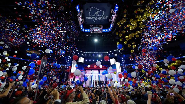 Republican presidential candidate and former president, Donald Trump, and Republican vice presidential candidate Sen. JD Vance, R-Ohio, watch with their families as the balloons fall during the final day of the Republican National Convention Thursday, July 18, 2024, in Milwaukee. (AP Photo/Jae C. Hong)