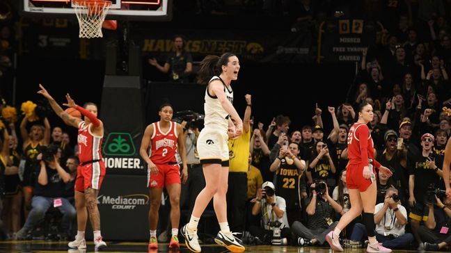 Iowa guard Caitlin Clark (22) celebrates after becoming the all-time leading scorer in NCAA Division I basketball during the first half of an NCAA college basketball game, Sunday, March 3, 2024, in Iowa City, Iowa. (AP Photo/Cliff Jette)