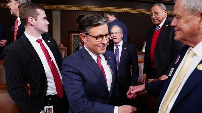 Speaker of the House Mike Johnson, R-La., center, arrives before President Joe Biden delivers the State of the Union address to a joint session of Congress at the Capitol, Thursday, March 7, 2024, in Washington. (Shawn Thew/Pool via AP)