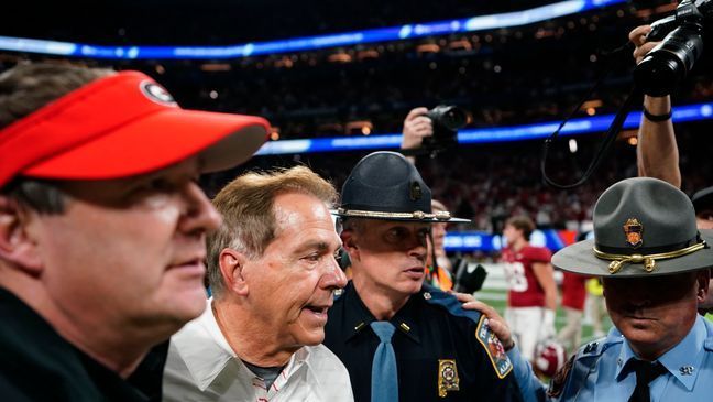 Georgia head coach Kirby Smart, left, and Alabama head coach Nick Saban, right, walk after the Southeastern Conference championship NCAA college football game in Atlanta, Saturday, Dec. 2, 2023. (AP Photo/Brynn Anderson)