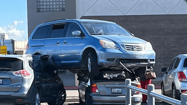 A van somehow landed atop 2 other vehicles at Bassett Place, a mall in El Paso, Jan. 18, 2023. (Gwenyth Adkins)