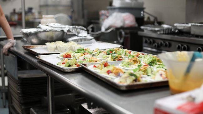 On August 15th, Melanie and Tyler Tapajna were married in front of families and friends, but the couple had to cancel their wedding reception because of to the COVID-19 pandemic. So, the couple donated and served their reception food to Laura's Home in Cleveland, Ohio.  (Courtesy: Caroline Stoltzfus/The City Mission) 