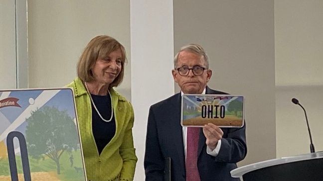 First lady of Ohio Fran DeWine and her husband Gov. Mike DeWine unveiled the state's new license plate on Thursday. (WSYX){&nbsp;}