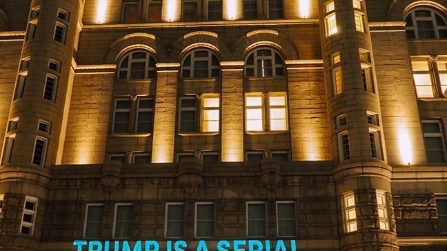 'Groper-in-Chief,' 'Impeach Trump' among statements projected onto Trump Hotel in DC. (Courtesy of Care2, a social network activist group)