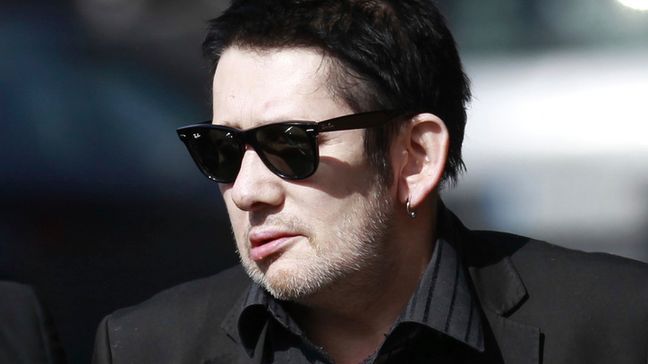 FILE - Irish singer Shane MacGowan attends the funeral mass of Irish poet Seamus Heaney at the Church of the Sacred Heart in Donnybrook, Dublin, Ireland, Monday, Sept. 2, 2013.{&nbsp;} (AP Photo/Peter Morrison, File)