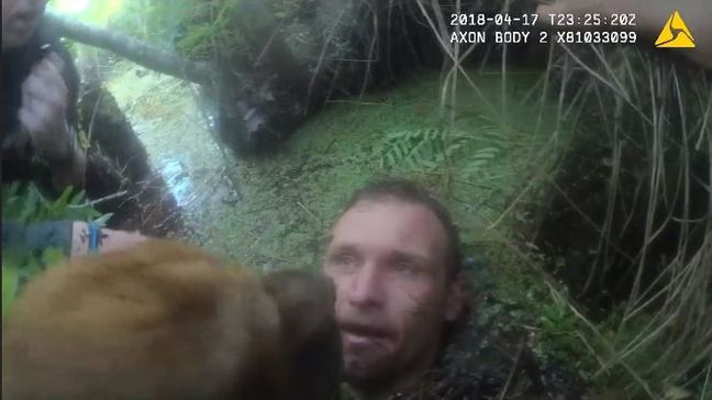 Pasco County, Fla., K-9 and deputies chase a suspect into a muddy swamp. (Pasco County Sheriff's Office)