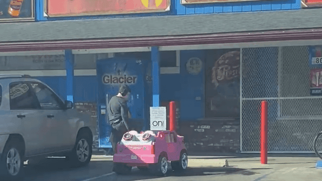 A Visalia man was casually going through his day when he spotted a young boy pulling up to the neighborhood store to buy stuff on a pink toy car. (Photo: Eric Sapien)