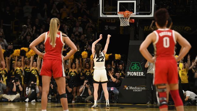 Iowa guard Caitlin Clark (22) sinks a technical foul to become the all-time leading scorer in NCAA Division I basketball during the first half of a college game against Ohio State, Sunday, March 3, 2024, in Iowa City, Iowa. (AP Photo/Cliff Jette)