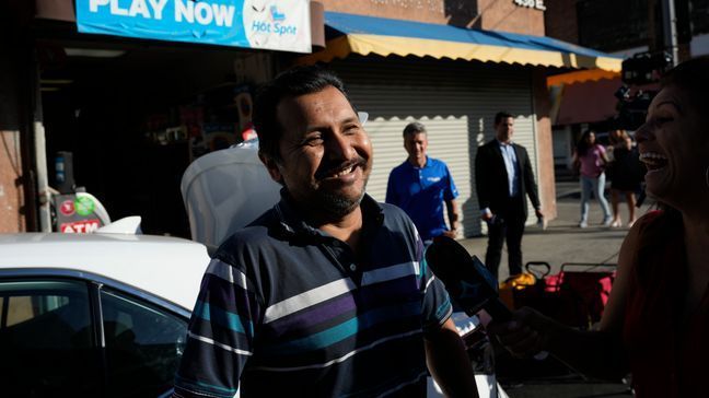 Navor Herrera stands for an interview outside the Las Palmitas Mini Market where the Powerball winning lottery ticket was sold in downtown Los Angeles, Thursday, July 20, 2023.  The winning ticket for the Powerball jackpot is worth an estimated $1.08 billion and is the sixth largest in U.S. history and the third largest in the history of the game. (AP Photo/Marcio Jose Sanchez)