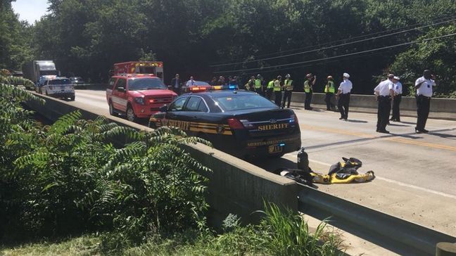 Crews were searching around Big Walnut Creek in south Columbus after reports a tractor trailer hit a bicyclist, knocking him over a guardrail on Tuesday morning, June 26, 2018. Police said the driver fled. (WSYX/WTTE)