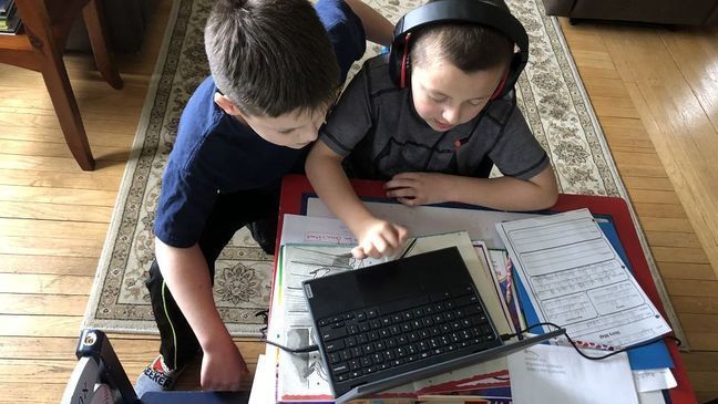 Two brothers work together on remote learning. (Dan/Chime in)